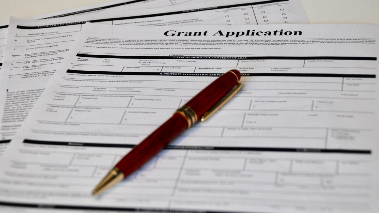 Grant application and pen